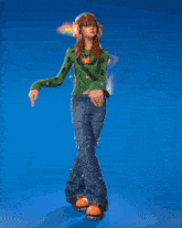 a girl in a green sweater and blue jeans is dancing in front of a blue background
