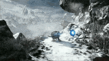 a computer generated image of a snowy mountain with a blue object in the foreground