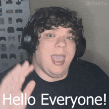 a man wearing headphones says hello everyone with his tongue hanging out