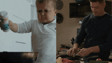a little boy is holding a salt shaker and a man is cooking