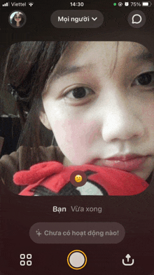 a woman 's face is displayed on a phone screen with the time displayed as 14:30