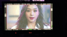 a woman 's face is displayed on a screen that says focus at the bottom