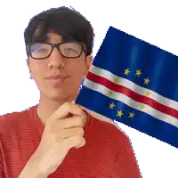 a man with glasses is holding a small flag