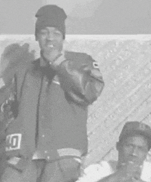 a man wearing a beanie and a jacket with the number 10 on it
