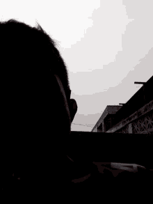 smoke is coming out of a person 's head in the dark