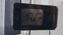 a metbeo thermometer displays a temperature of 52 degrees celcius