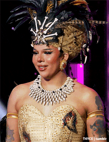 a woman is wearing a feathered headdress and a necklace with bones