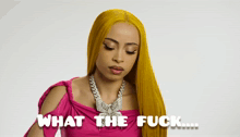 a woman with yellow hair is wearing a pink dress and necklace and says " what the fuck "