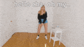 a woman standing in a room with the words hello cha oh my