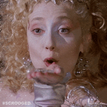 Blowing Glitters Ghost Of Christmas Present GIF - Blowing Glitters Ghost Of Christmas Present Scrooged GIFs