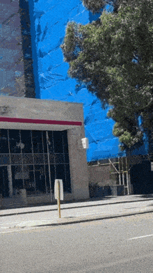 a building with a sign that says no parking on the side of it
