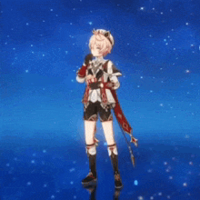 a boy in a cat costume is standing in front of a blue background with stars .