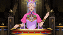 a woman in a purple and pink dress stands in front of a podium