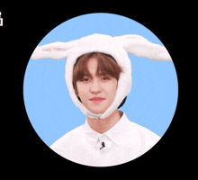 a person wearing a white bunny hat with ears