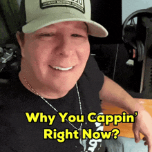 a man wearing a hat and a black shirt says why you cappin right now
