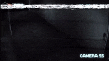 a camera is recording a dark room and the time reads 6:56