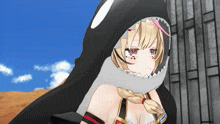 a girl is wearing a shark hood with sharp teeth on it