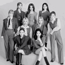a black and white photo of a group of girls