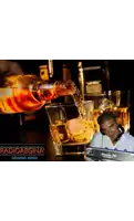 a man in headphones is pouring whiskey into a glass with the words radioaegina on the bottom