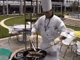 a man in a chef 's uniform is cooking a meal