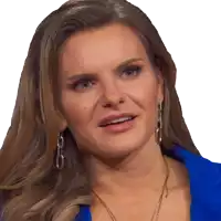a woman wearing a blue shirt and earrings is looking at the camera