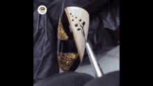 a person is applying nail polish to a nail with a brush