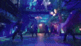 a group of people are dancing in a dark room with neon signs .