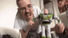 guy playing toy story buzz lightyear action figure