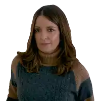 a woman wearing a turtleneck sweater looks at the camera with a serious look on her face