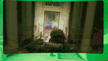 a video game screen shows a police officer in a room