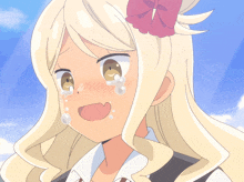 a girl with blonde hair and a red flower in her hair crying