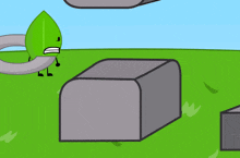 a green leaf is sitting on a block with a fork sticking out of it