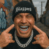 a man wearing a black beanie with blazzard written on it