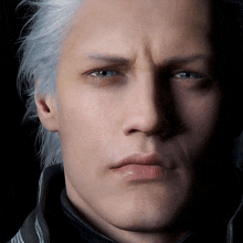 a close up of a man 's face with his eyes closed