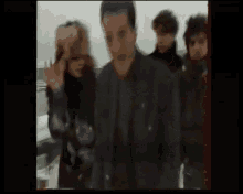 a blurry picture of a group of people walking