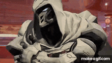a video game character with a hood on his head is standing in a room with a red background .