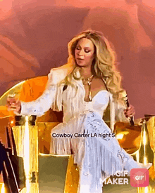a woman in a cowboy carter la night 5 dress