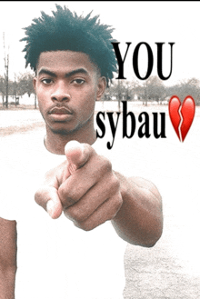 a young man pointing at the camera with the words you sybau on the bottom right