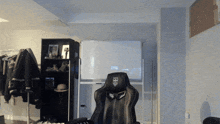 a black chair with a shield on the back of it