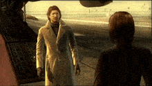 a man in a white coat stands next to a woman
