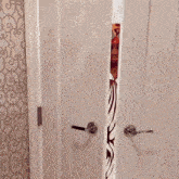 a woman in a red and white dress is peeking out of a doorway