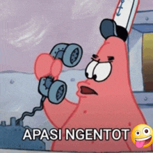 patrick star from spongebob squarepants is talking on a telephone with a smiley face .