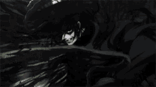 a man with red eyes is standing in the dark with a shadow of a person behind him .