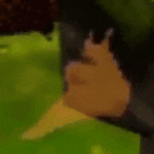 a close up of a snail 's tail on a green background .
