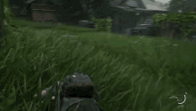 a person in a video game laying in the grass with a arrow pointing to the left