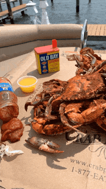 crabs and a can of old bay seasoning on a table