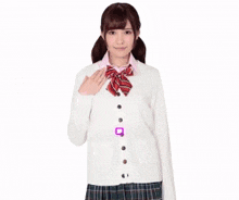 a girl wearing a blue cardigan and plaid skirt is standing in front of a banner that says elite