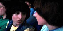 a man and a girl are looking at each other