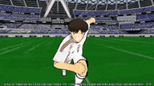 a soccer player is kneeling down on a field in front of a stadium