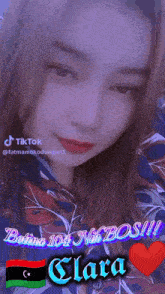 a girl with the name clara on her face